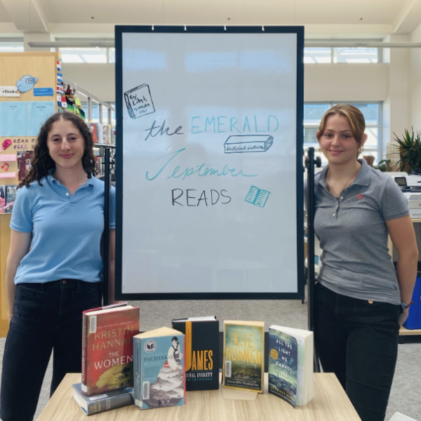 Simone Cohen ‘27 and Lily Cardenas ‘27 with this month's book selections.